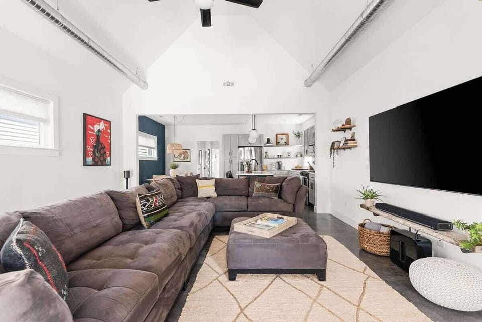 Kick back and relax in the living room with a 75" smart tv and Sonos surround sound. *Please note, we have upgraded this couch to a Crate & Barrel L-couch since these photos were taken*