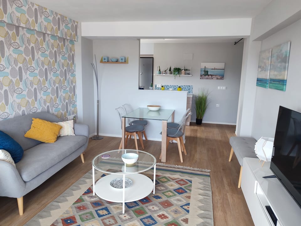 Living area through to open kitchen.  AC hot / cold.  Smart tv with UK satellite