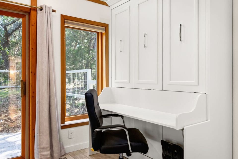Private workspace during the day. Queen size murphy bed at night.