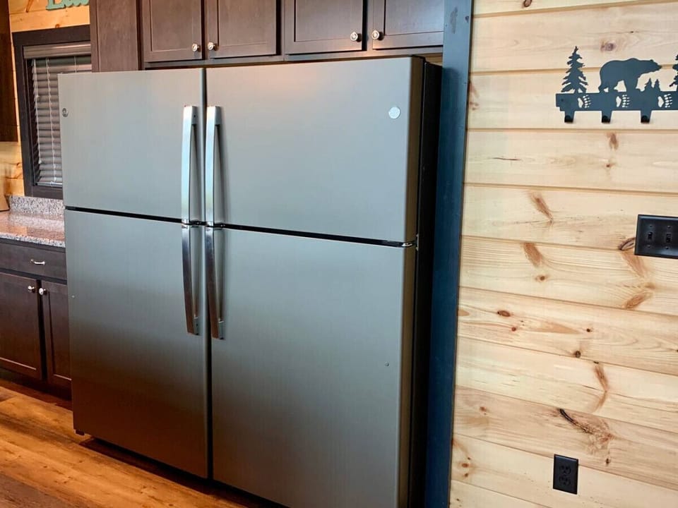The kitchen has two large refrigerators to hold food and drinks for all guests.