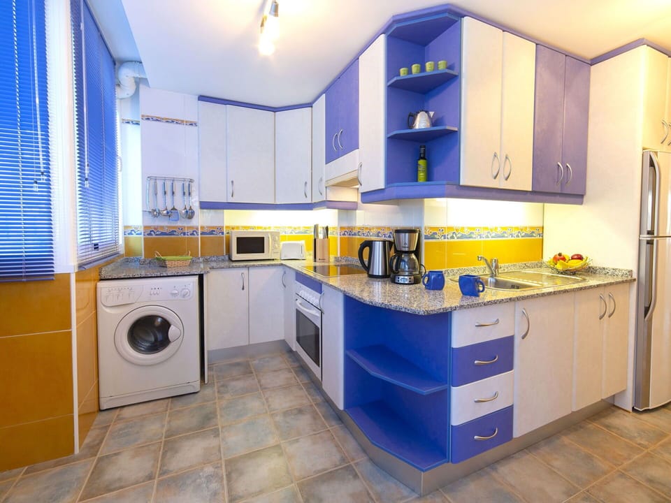 Cabinetry, Room, Countertop, Kitchen, Property, Furniture, Yellow, Interior Design, Major Appliance, Building