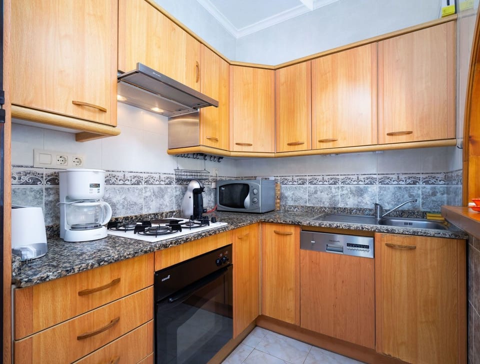 Countertop, Cabinetry, Property, Kitchen, Room, Furniture, Interior Design, Kitchen Stove, Building, Home