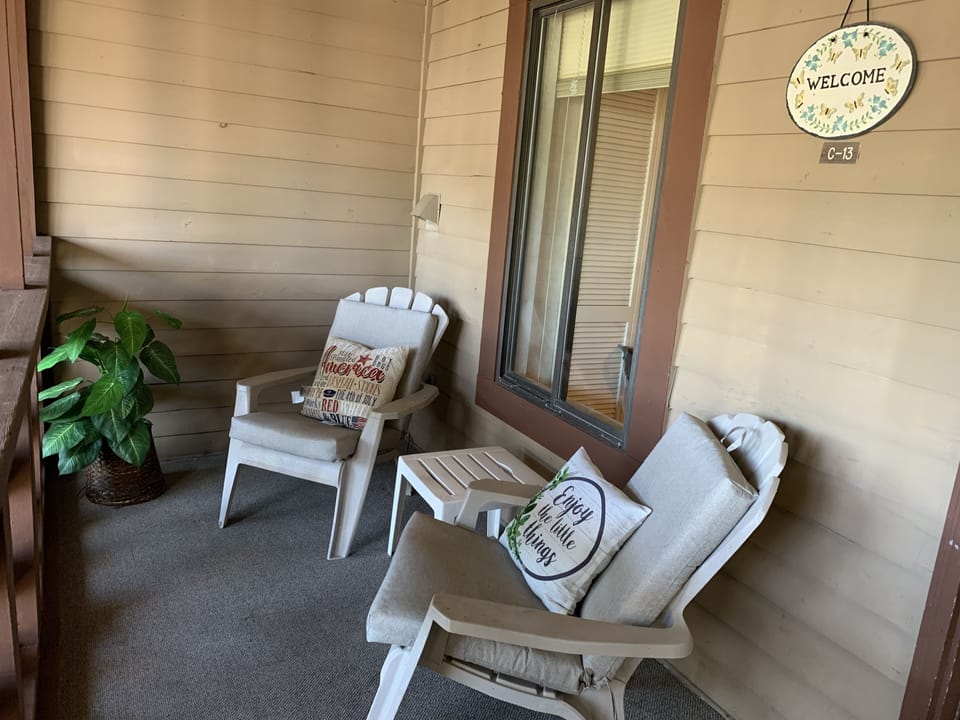 Welcoming private, screened front porch
