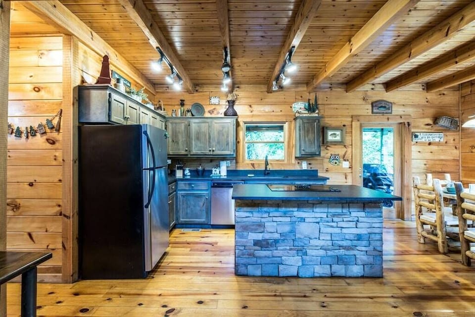 Large Kitchen. Smooth top stove in island. Lots of cabinet storage in island too