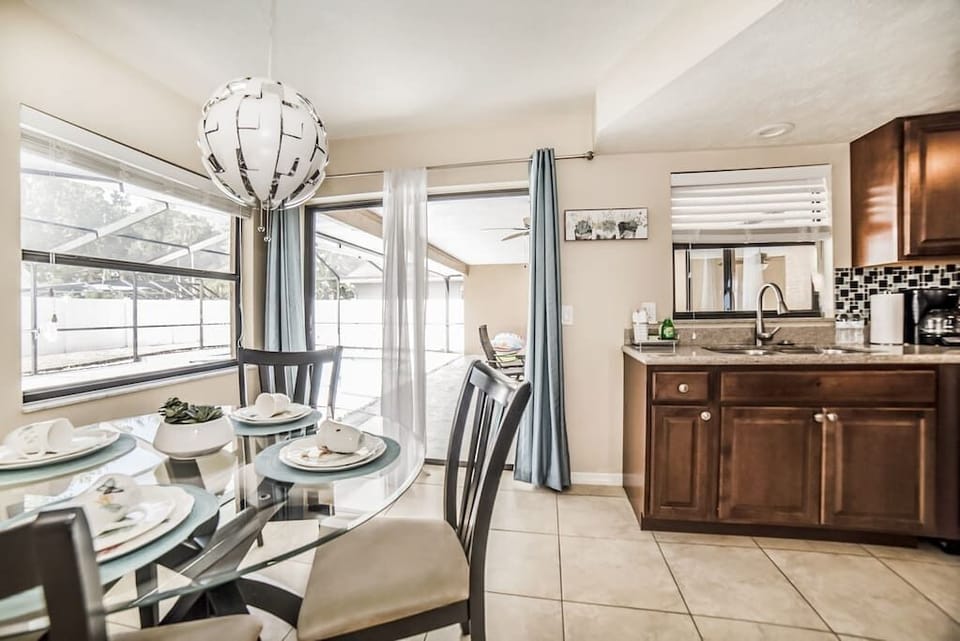 Gather around the elegant dining area just steps away from the patio and pool