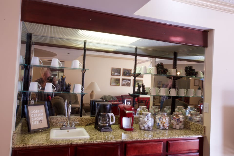Coffee bar with Kuerig and drip coffee maker.