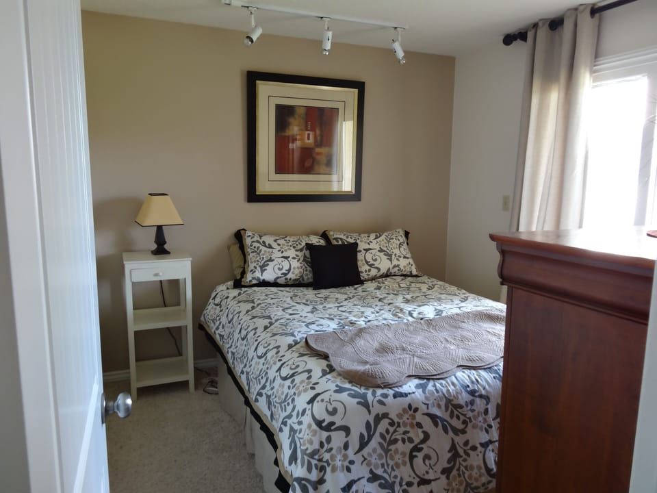 Second bedroom.  Deck off this bedroom.  Full size bed
