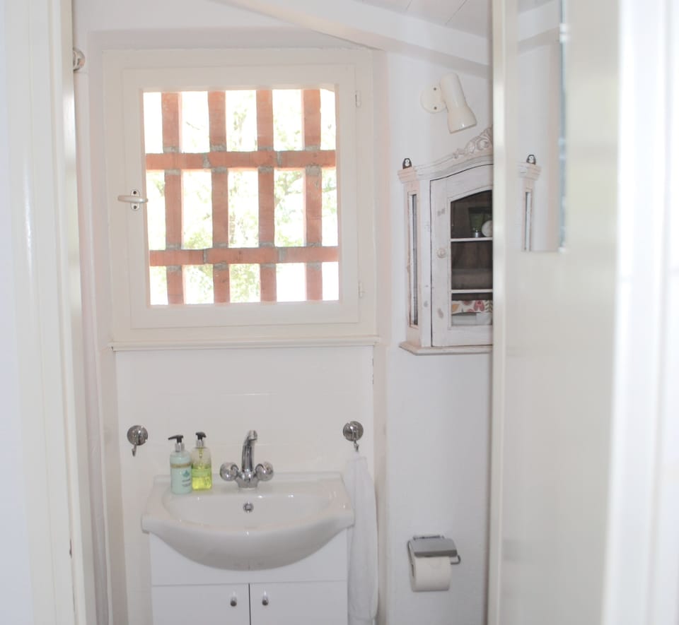 Bathroom with walk-in shower, quality toiletries and bath towels