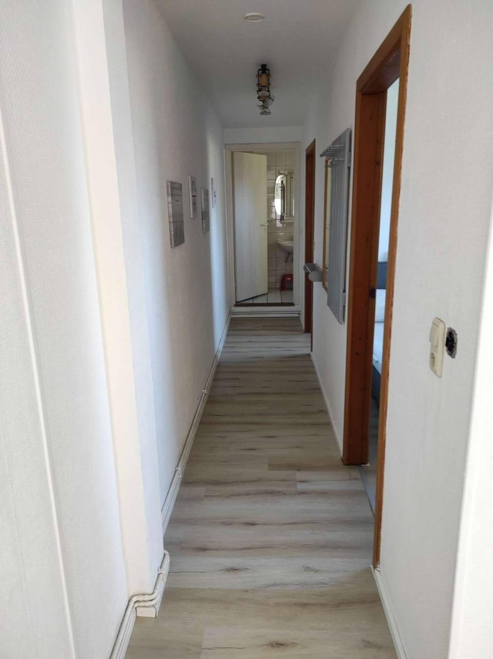 the corridor to the bedrooms and bathroom