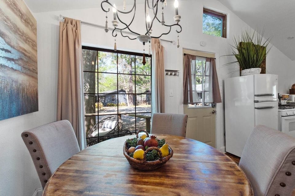 Dining table with sweeping views of Emerald Isle & Cross lake