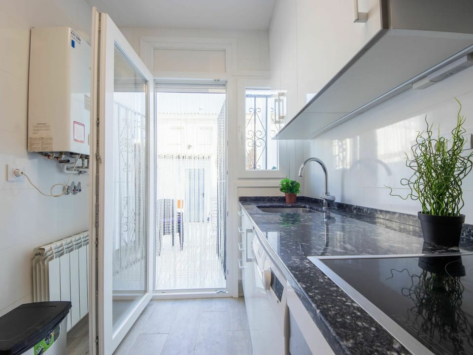 Building, Cabinetry, Countertop, Tap, Kitchen, Interior Design, House, Plant, Floor, Flooring