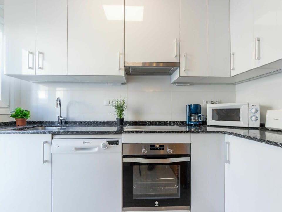 Cabinetry, Property, Countertop, Kitchen Stove, Kitchen Appliance, Lighting, Kitchen, Home Appliance, Interior Design, Sink