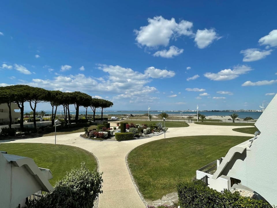 Sky, Cloud, Plant, Shade, Land Lot, Urban Design, Public Space, Grass, Landscape, Leisure