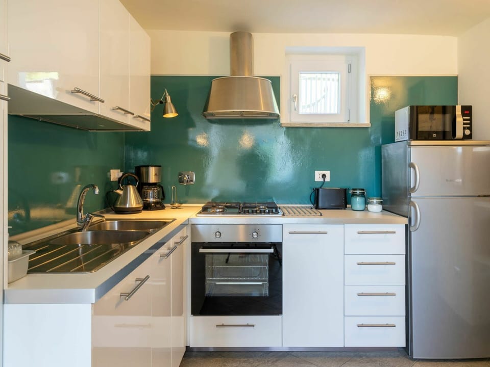 Countertop, Cabinetry, Kitchen, Room, Furniture, Property, Turquoise, Green, Interior Design, Kitchen Stove