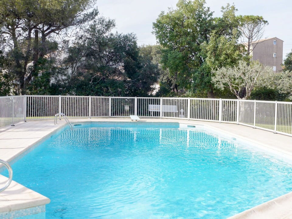 Water, Plant, Sky, Swimming Pool, Tree, Azure, Chair, Outdoor Furniture, Rectangle, Body Of Water