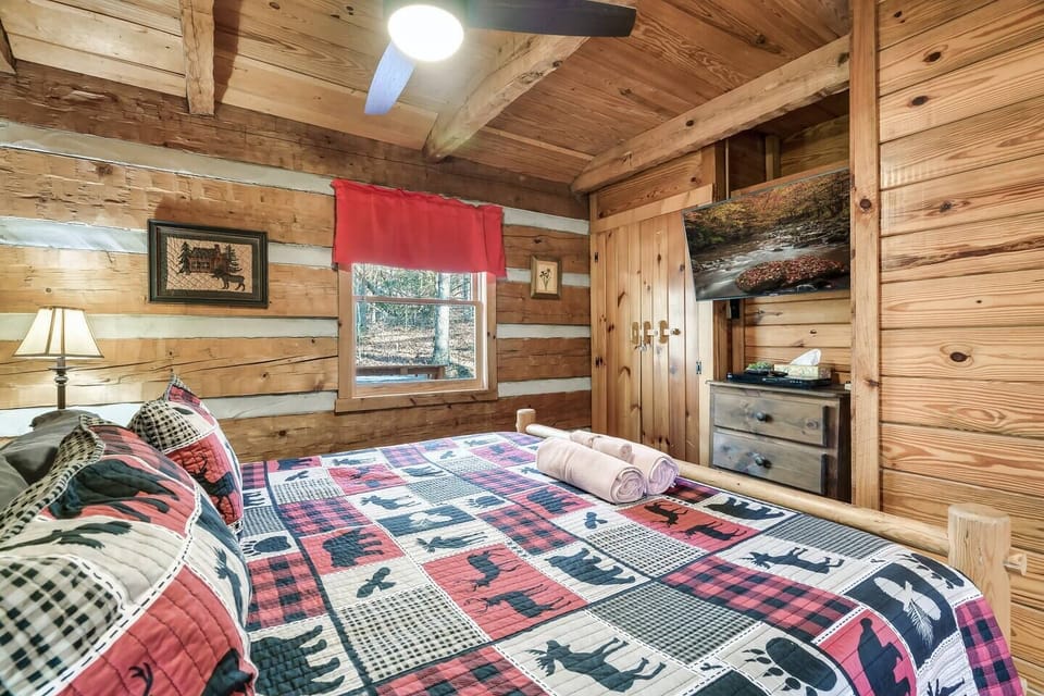 Your bedroom has a charming, rustic cabin theme.