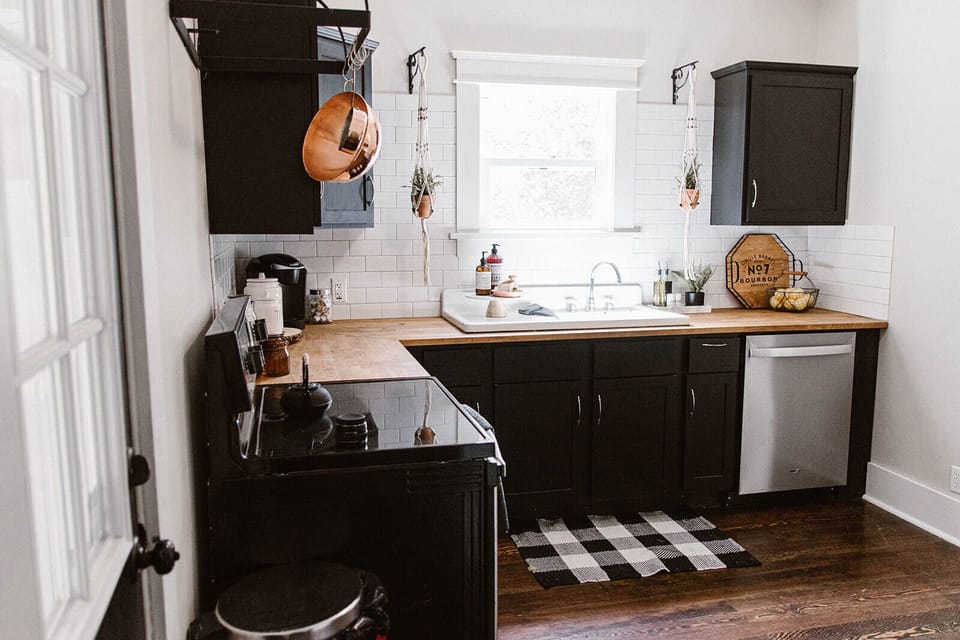 Kitchen with stove, oven, sink dishwasher, fridge, cooking and baking utensils