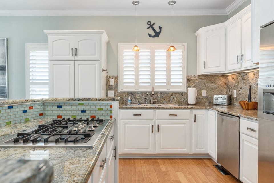 Well stocked kitchen.  Pots, pans, waffle iron, knives, place settings.  