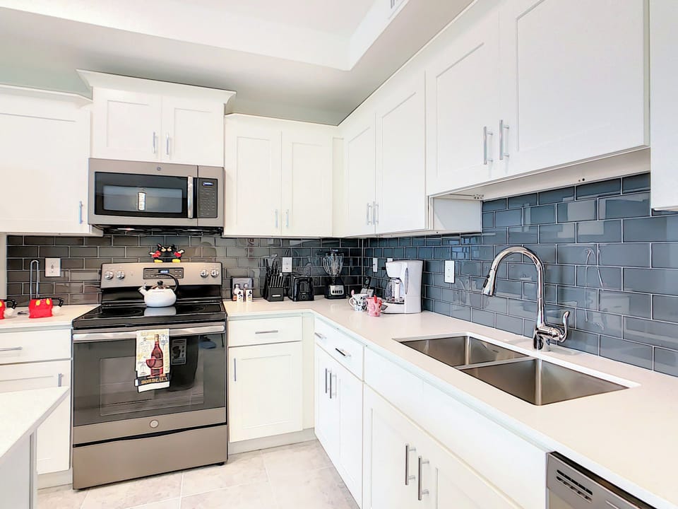Modern kitchen with white cabinets and subway tile backsplash