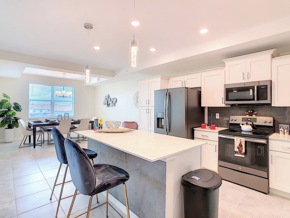 Modern Kitchen with Island Seating and Stainless Appliances