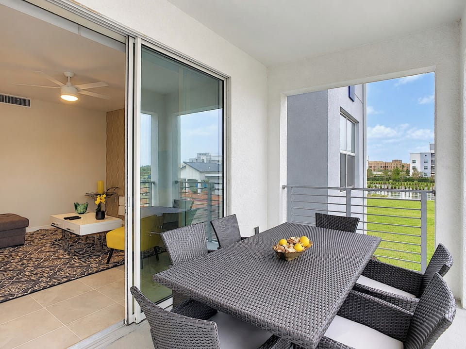 Private Covered Balcony with Outdoor Dining Table and Chairs