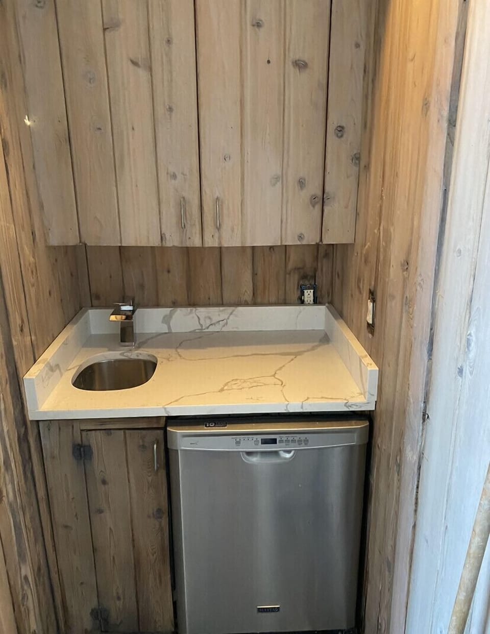 Outdoor kitchen with dishwasher and sink 