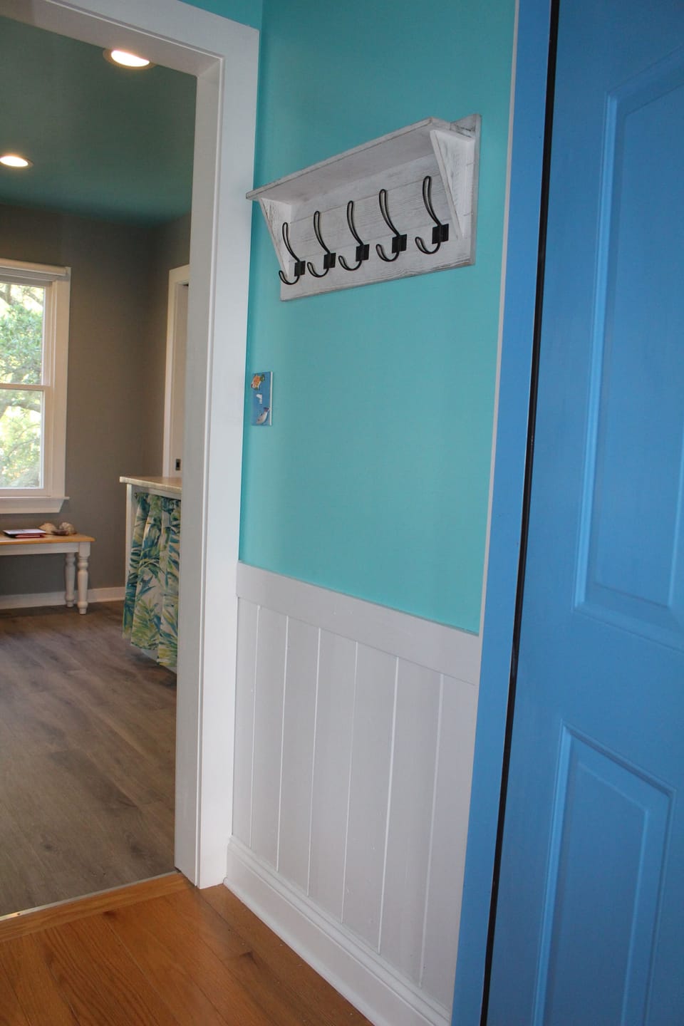Private entry with beach towel and coat rack.