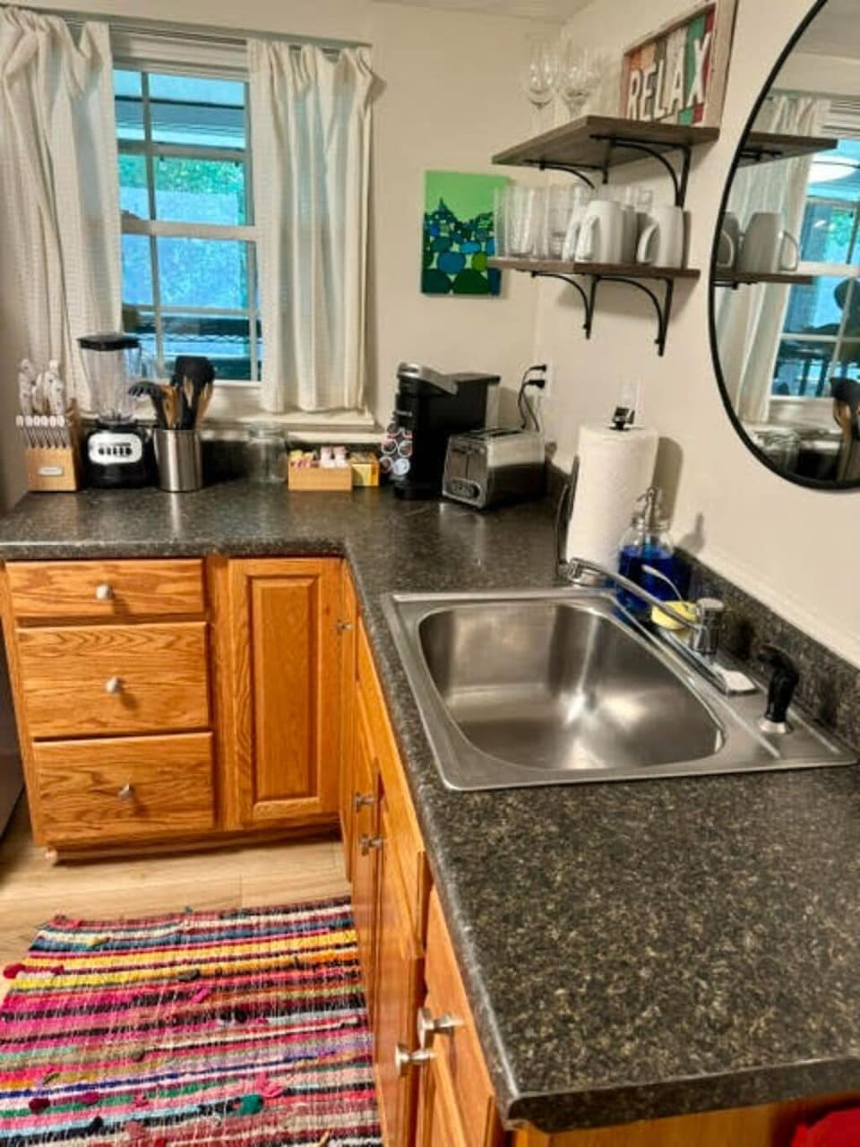 The kitchen is filled with natural light, highlighting the elegant finishes