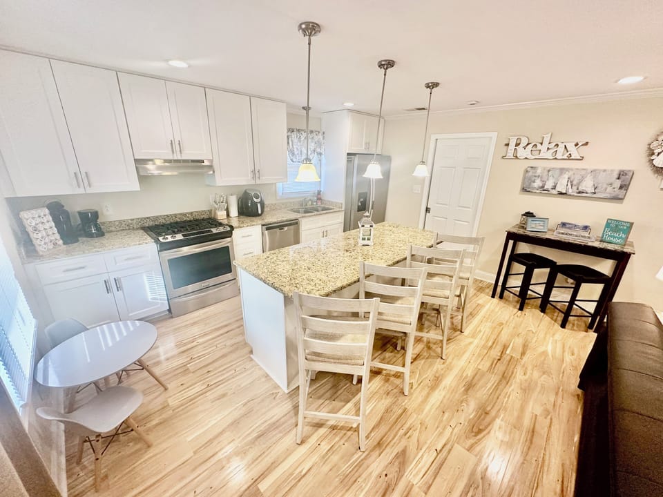Kitchen area with island seating and small kids table