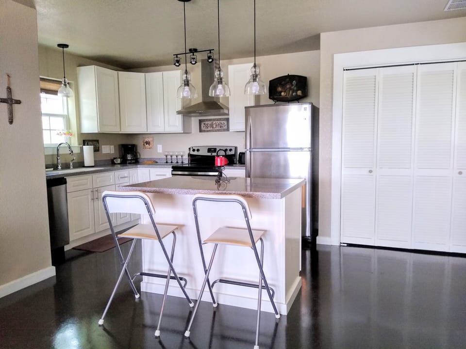 Bright, clean kitchen has full size appliances and island...