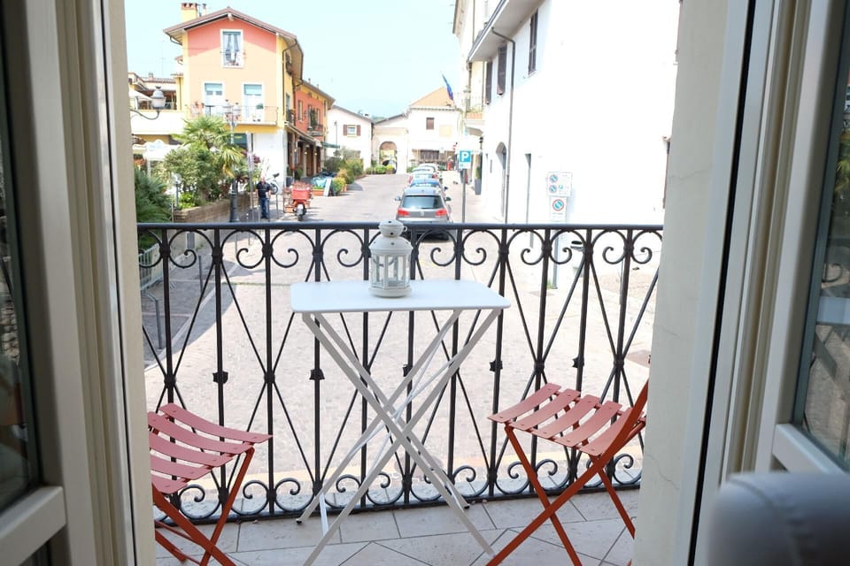 View from the window. Balcony from the living dining area to the piazza