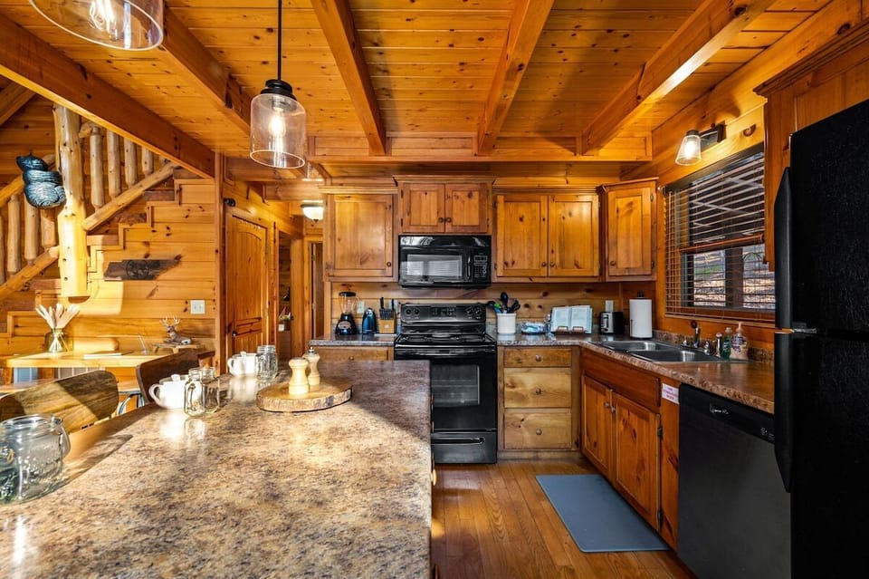  Our kitchen opens into the living room, creating an inviting space where conversation and laughter flow freely, making it easy to connect and share moments with family and friends.
