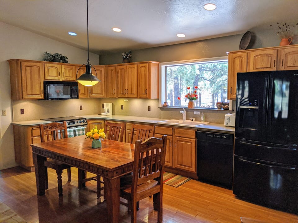 Kitchen with pantry and dining area.