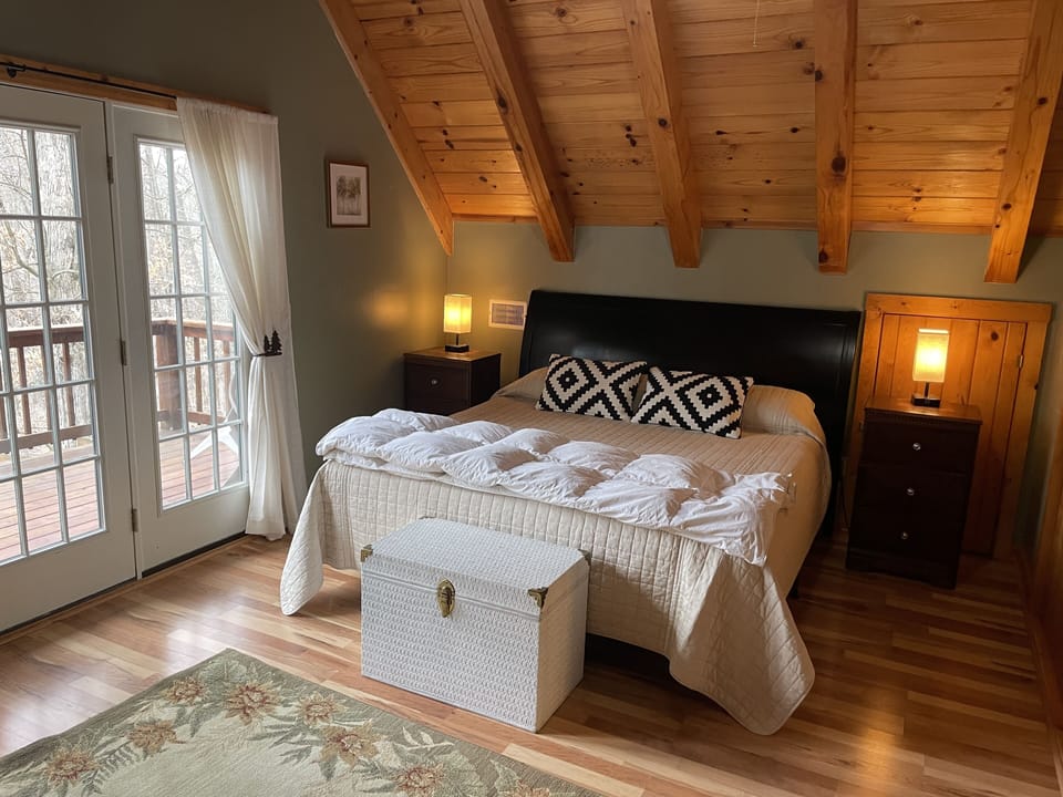 Master Bedroom King w/ TV and private balcony.