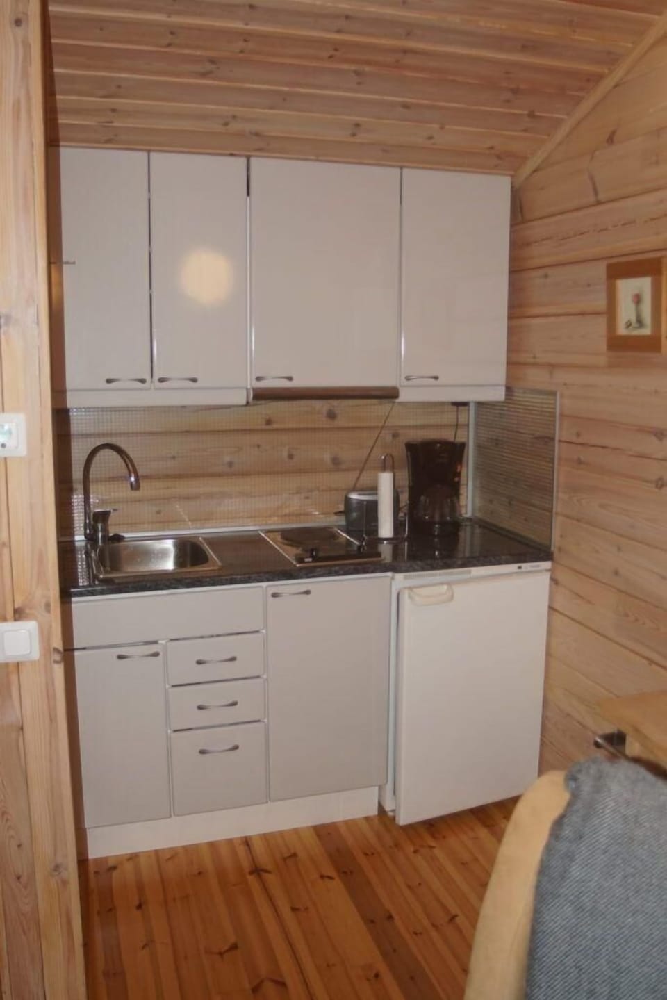 Kitchen area. Lakeside sauna building