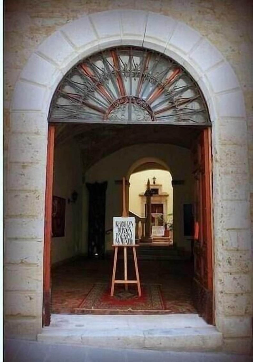 External view of the building. Entrance of Palazzo Malfatti