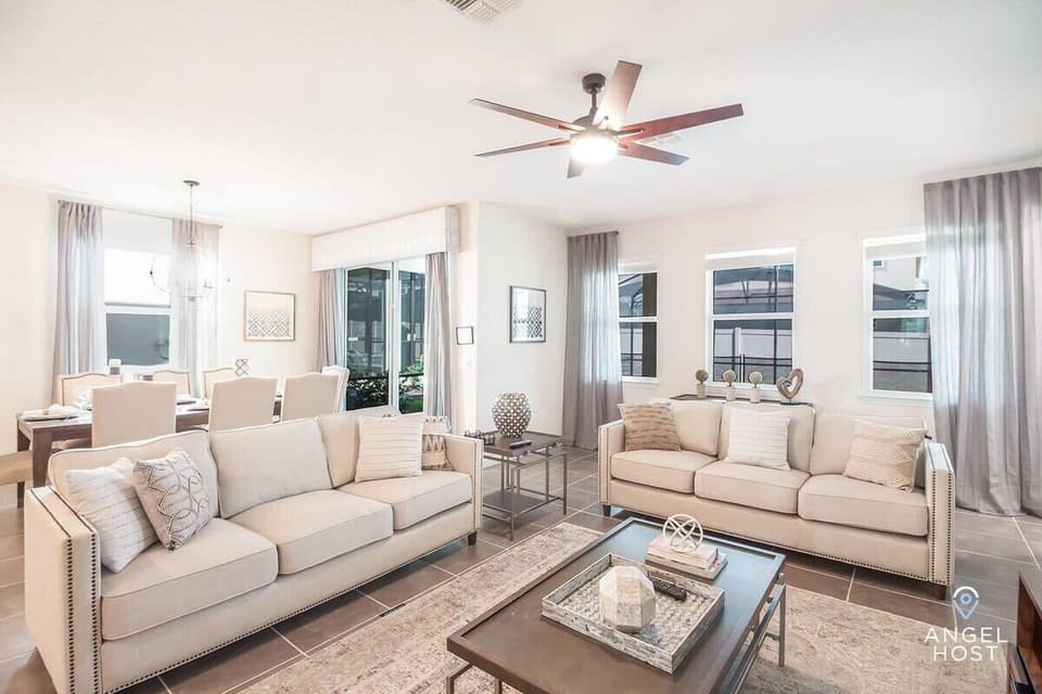 The living room is spacious and has direct access to the private pool.