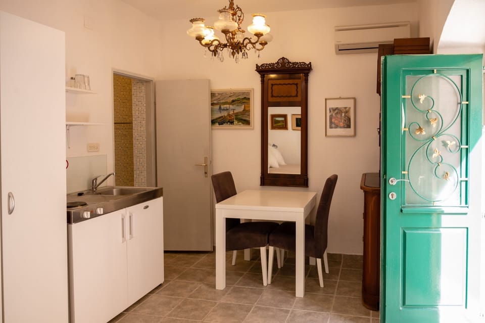 Well-equipped kitchenette with dining area.