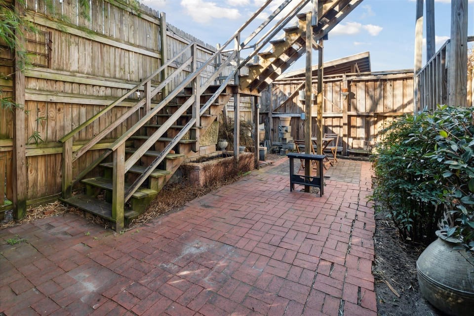 The home has a private courtyard shared with the lower unit.