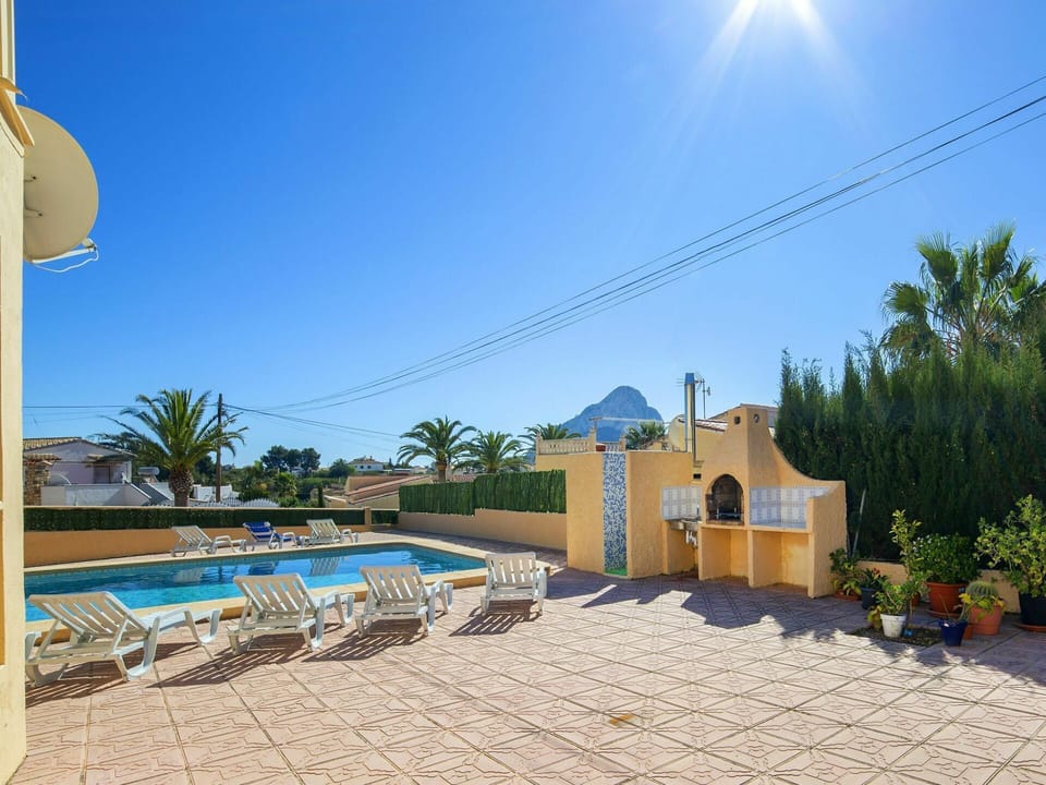 Sky, Plant, Building, Azure, Tree, Shade, House, Arecales, Outdoor Furniture, Flowerpot