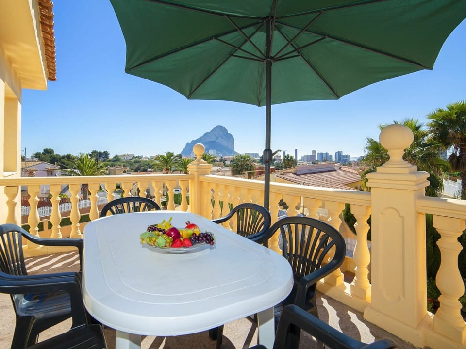 Table, Furniture, Property, Sky, Green, Chair, Plant, Nature, Umbrella, Building