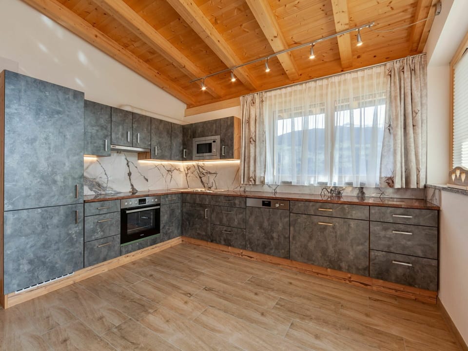 Cabinetry, Countertop, Building, Wood, Interior Design, Window, Flooring, Floor, Wood Stain, Kitchen