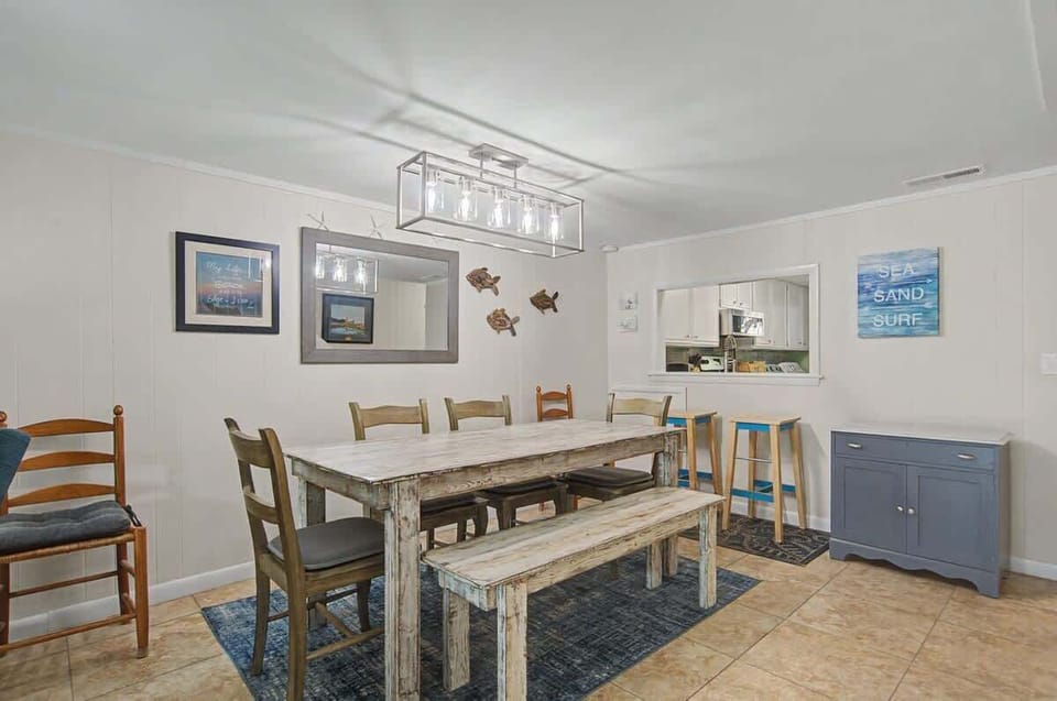Spacious dining area with ample seating, thoughtfully positioned for easy flow from the kitchen and living space - ideal for both casual breakfasts and relaxed evening dining.