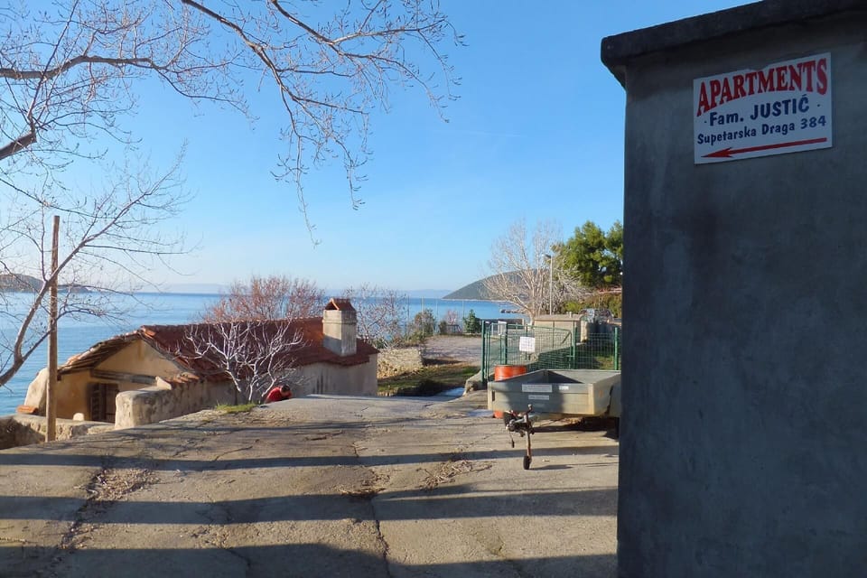 Area that directly surrounds the property. The road to the apartments Justic