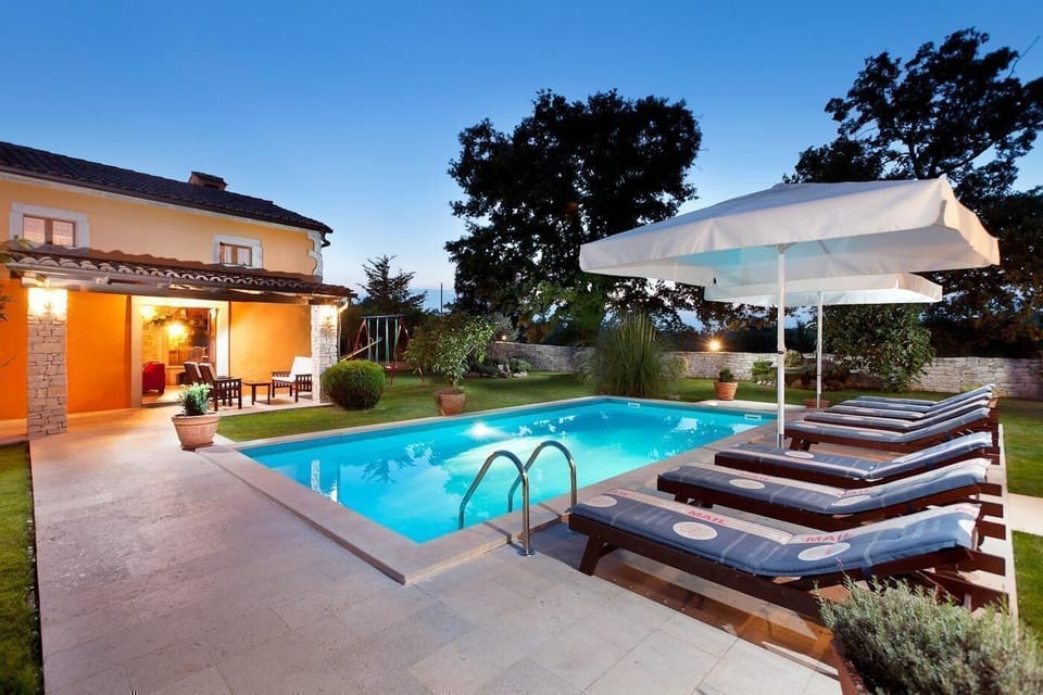 External view of the building. house with pool, lighting creates a romantic environment