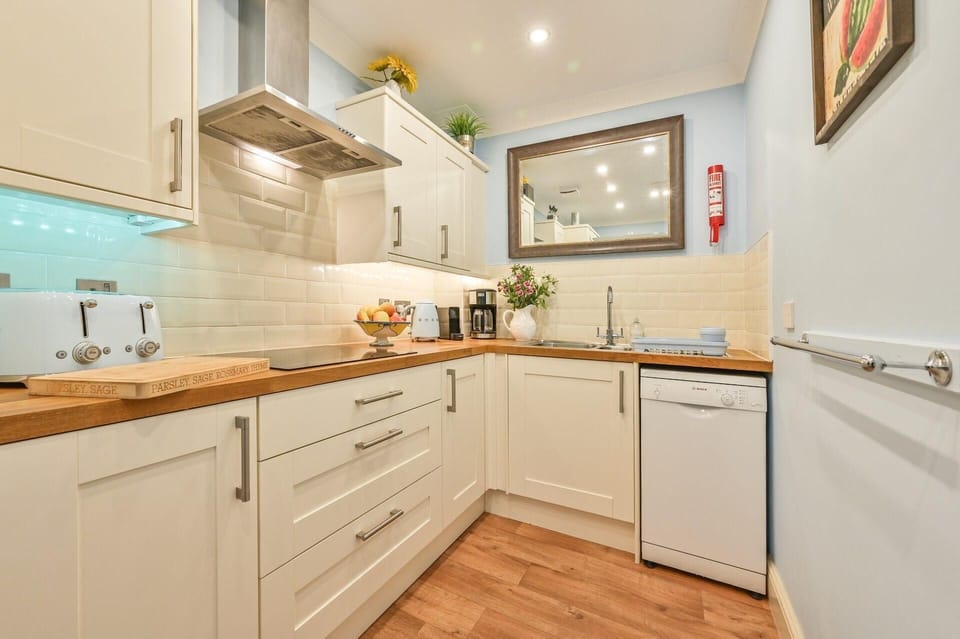 Kitchen area. Modern well equipped kitchen with dishwasher.