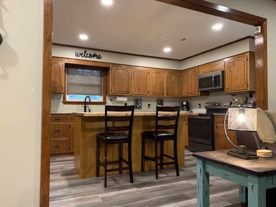 Gather around the butcher block island. 