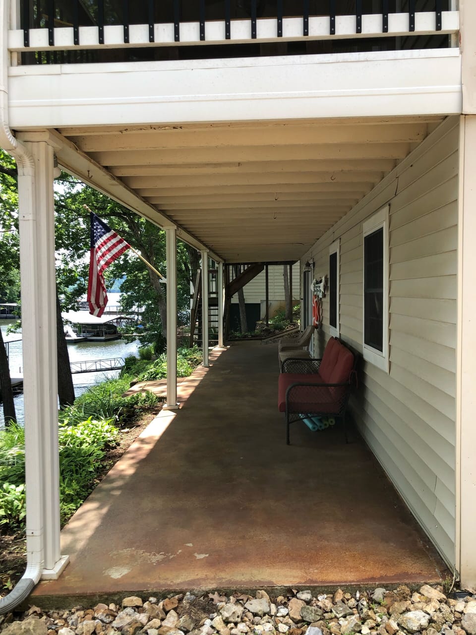 Lower patio with access to the house, dock, or screened-in porch upstairs. 