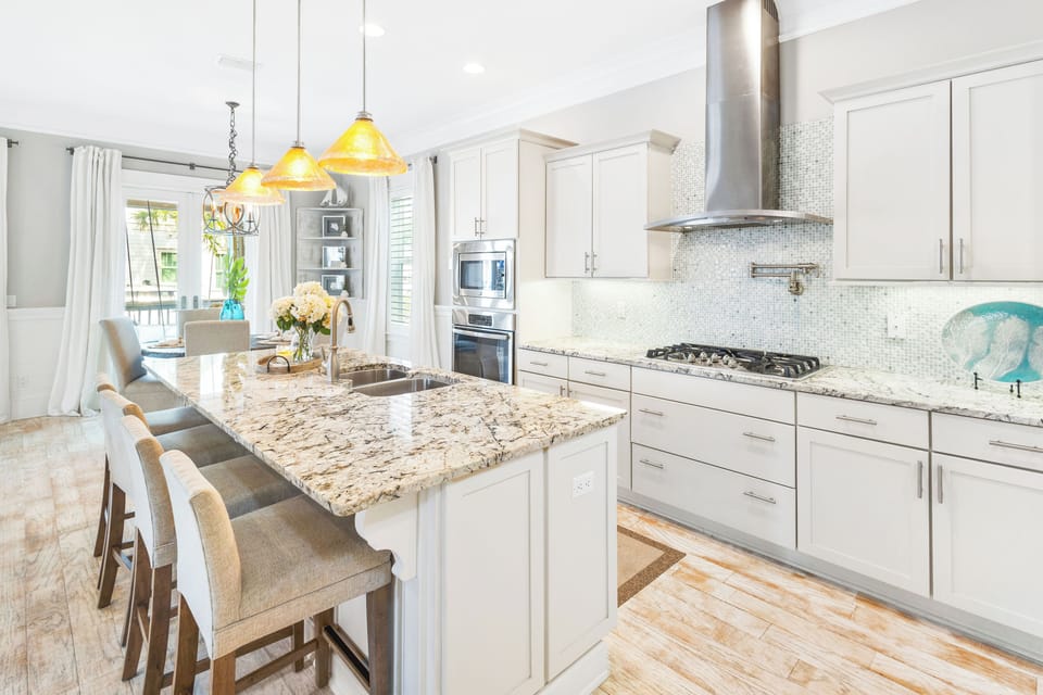 Fully stocked kitchen with large pantry, pot filler, Keurig and island seating
