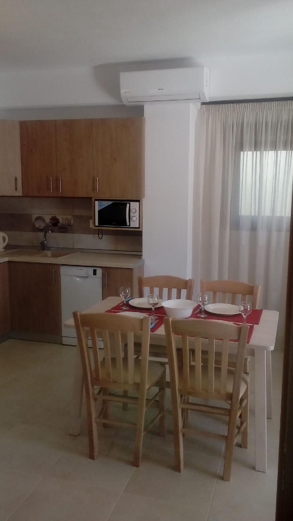 Dining area. AC over the kitchen which is in a good position in front of both bedrooms